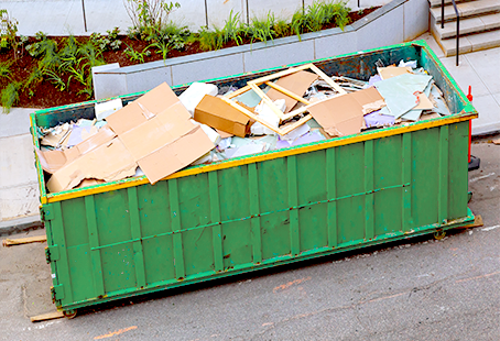 Dumpster filled with recyclable materials